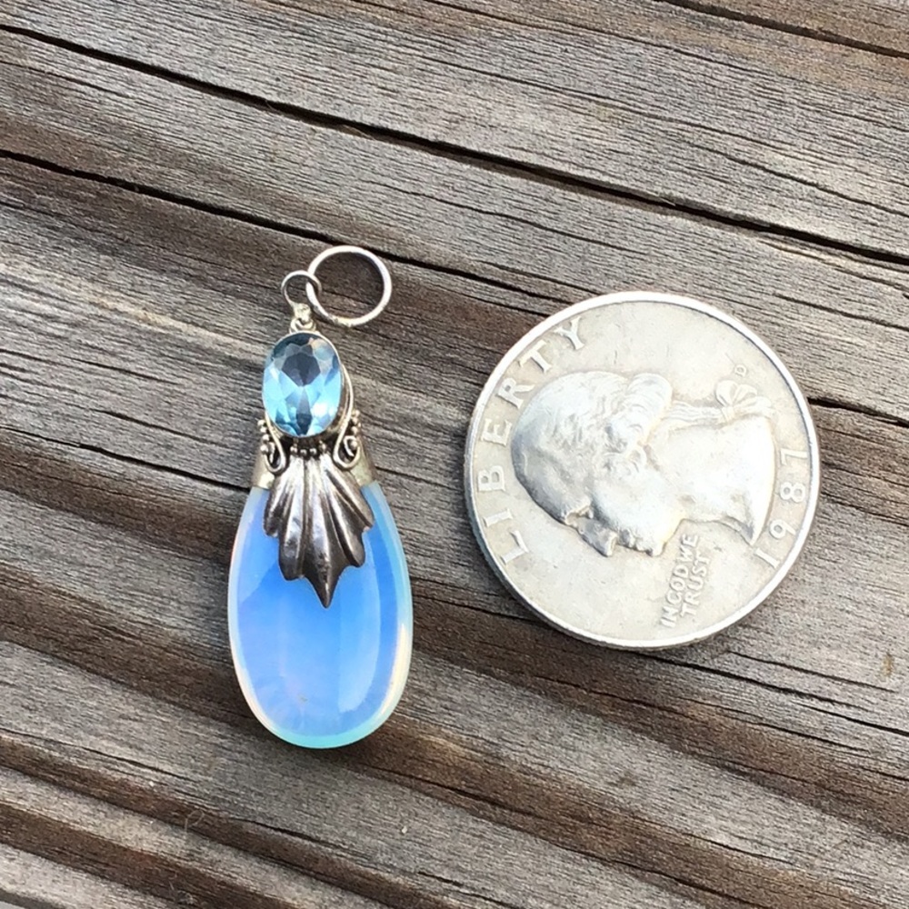 Vintage sterling silver pendant with a blue crystal and an opal teardrop
